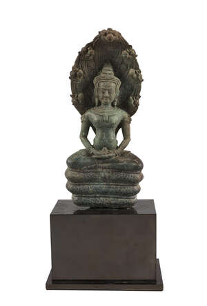 
	
		A Cambodian bronze Muchalinda Buddha, 17th century, seated on a coiled serpent base,...