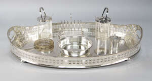 
	
		A large silver plated gallery tray, together with further plated items including a toast...