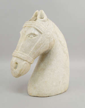 
	
		A white marble carving of a horses head, wearing a bridal, 31cm high

	

