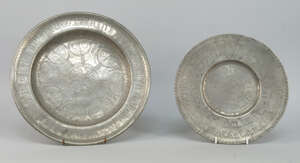 
	
		A Continental pewter plate, the rim incised with Hebrew characters and interlinked...