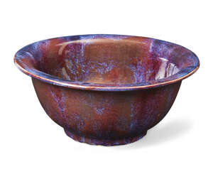 
	
		A Chinese stoneware flambé-glazed deep bowl, late 19th century, covered in a thick glaze...