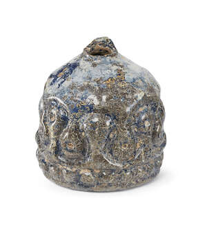 
	
		A blue glass bottle base with moulded decoration, Iran, 12th-13th century, decorated to...