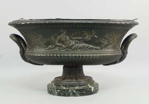 
	
		A Continental twin handled oval spelter urn, 19th century, decorated with Leda and the...