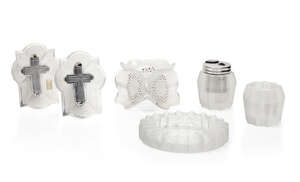 
	
		René Lalique (1860-1945), a pair of clear and frosted glass crucifixes with metal easel...