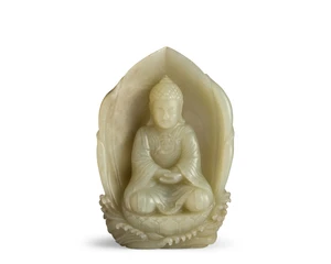 A Chinese pale jade carved figure of a seated Buddha
Qing dynasty, 19th century
Carved with the Buddha seated on a lotus base rising from sea waves, backed by 