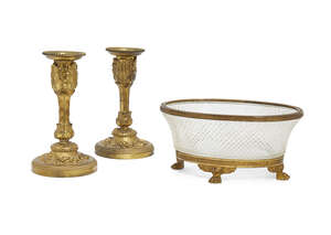 A pair of French ormolu candlesticks, late 19th/early 20th century, the columns with cast...