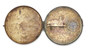 
	
		A Qajar engraved brass Qiblah indicator, Iran, 19th century, the lid opening, the face...