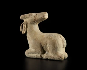 A fragmentary stone figure of recumbent Nandi, India, late19th century or earlier
Repaired and...