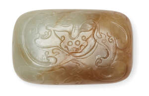 
	
		A Chinese celadon and russet jade belt buckle, Ming dynasty, 17th century, carved in low...