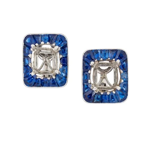A pair of French, sapphire earclips, each with a vacant rectangular central collet within calibré-cut sapphire surround, to clip fittings, French marks, and p