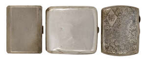 
	
		A group of three silver cigarette cases comprising a rectangular case, Birmingham,...