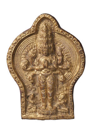 
	
		A Tibetan gilded terracotta plaque of Avalokitesvara, 18th century, depicted with eleven...