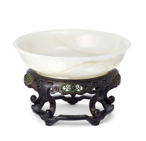 
	
		A Chinese white jade brushwasher, xi, Qianlong mark and of the period, carved to the...