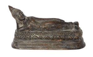 
	
		A Burmese bronze figure of Buddha, 19th century, reclining with head resting on right...