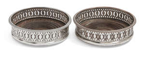 A pair of 19th century silver plated wine coasters, with turned wooden bases and gadroon edge to...
