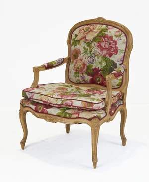A French beech fauteuil, of Louis XV style, third quarter 20th century,&nbsp;upholstered in floral...