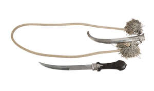 
	
		A jambiyya with wood hilt and silver sheath, Morocco, 20th century, the blade of curved...