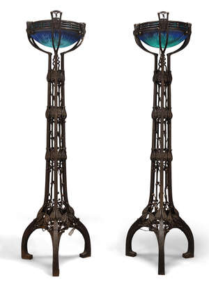 
	
		A pair of modern iron and glass uplighter floor lamps in the style of Louis Majorelle...