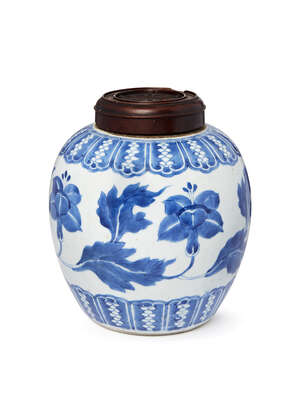 A Chinese porcelain jar, 18th century, painted in underglaze blue to the body with a continuous leafy flowering peony scroll, underglaze blue double ring mark 