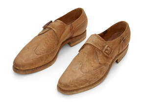 
	
		Livio De Marchi (Italian b.1943), a pine carving of a pair of shoes,
		c.1990, each with...