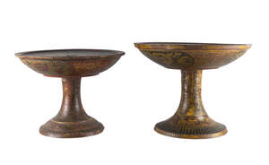 
	
		A pair of Thai painted wood circular stands, early 20th century, decorated with lotus...
