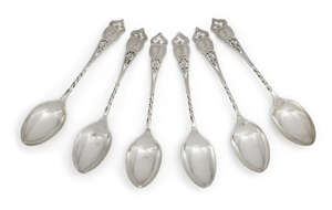 A set of six Edwardian silver teaspoons, Sheffield, c.1902, Henry Williamson Ltd., designed with half twist stems to decorative openwork terminals engraved wit