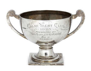A twin-handled silver trophy cup, Sheffield, c.1921, James Deakin & Sons, raised on a square foot, the body engraved: Colne Yacht Club, 1923, presented by Thos