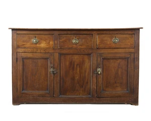 A George III elm dresser base, last quarter 18th century,&nbsp;with three drawers above two doors,...