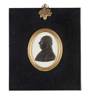 
	
		An English black paste portrait relief, possibly of George III, in the manner of James...