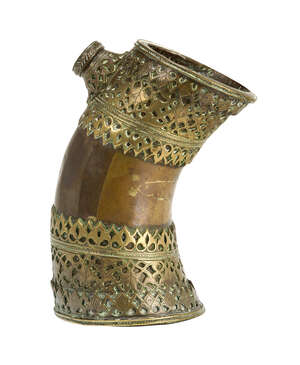 
	
		 A rare brass huqqa base in the form of a yak's horn, Skardo, Baltistan, 18th century,...
