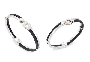 Two hinged bangles, each with black rubber sections, Italian marks, stamped 750, inner diameters...