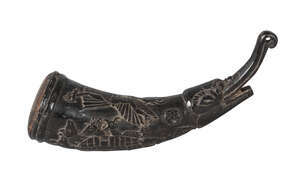 
	
		A Tibetan polished horn shaman's finial, 19th century, carved to one side with Garuda and...