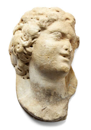 
	
		A carved marble relief of a Classical head, 16th century, gaze to dexter, 33cm high, 20cm...