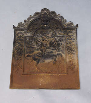 
	
		A cast iron fire back, 19th century, moulded in high relief with a scene of a knight on a...