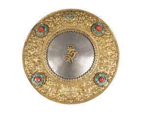 
	
		A large Tibetan gilt copper and zinc oracle mirror, 19th century, the circular zinc...