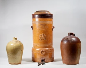 Three large English salt-glaze stoneware vessels, 19th century, to include a Bischof's Spongy Iron Filter, Special No. 3 Improved, with moulded twin carry hand