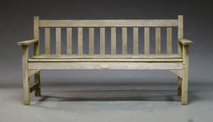 
	
		A teak garden bench by R.A Lister & Co. late 20th Century, the rail and slatted back...