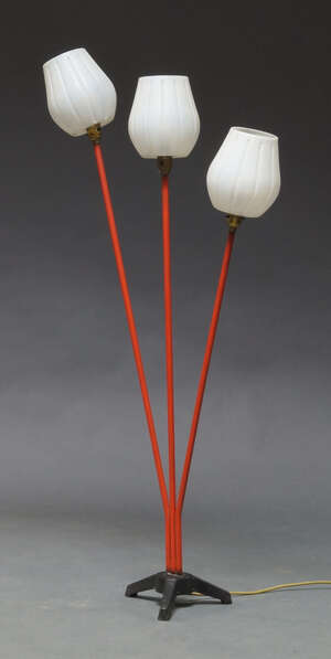 
	
		A British three light standard lamp, c.1950's, with tulip shaped plastic shades, on red...