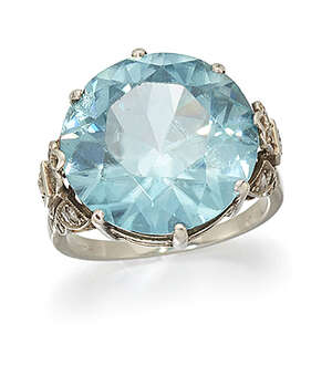 
	
		A zircon and diamond ring, the circular-cut blue zircon to single-cut diamond tapered...