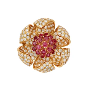 A ruby and diamond floral cluster pendant, designed as a central cluster of round mixed cut...