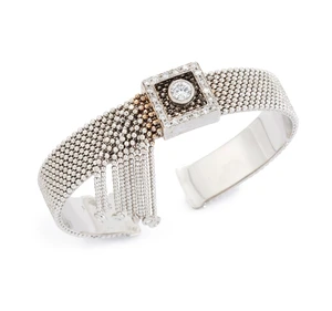 A diamond torque bangle, with brilliant-cut diamond buckle form panel with a central collet-set...