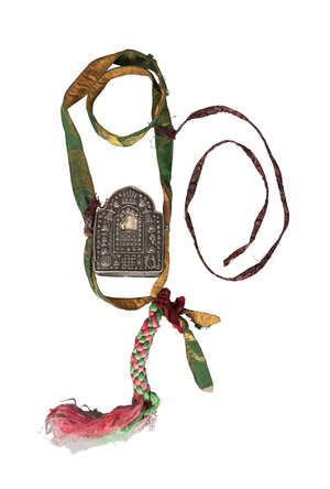 
	
		A Tibetan repousse silver and copper backed gau, 19th century, the front decorated with...