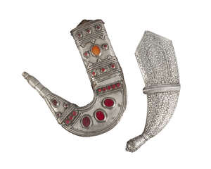 
	
		Two silver sheaths, Yemen, late 19th/early 20th century, one of filigree work,  the other...