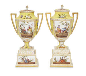 
	
		A pair of German porcelain twin handled urns and covers, late 19th/early 20th century, 