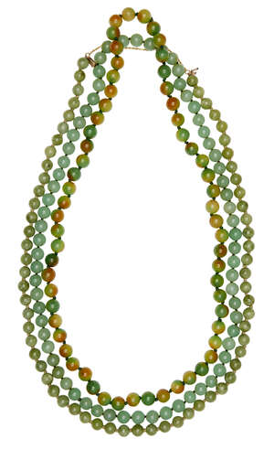 
	
		Three jade/jadeite bead necklaces, 20th century, all in tones of green, one with...