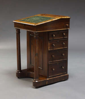 
	
		A Victorian rosewood Davenport, the fall front top inset with green leather surface,...