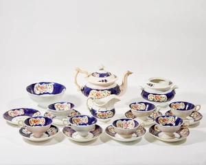 A Victorian porcelain tea service with 'Gaudy Welsh' type decoration, unmarked, with painted...