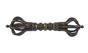 
	
		A Tibetan parcel gilt bronze vajra, 15th century, cast to the handle with bands of lotus...