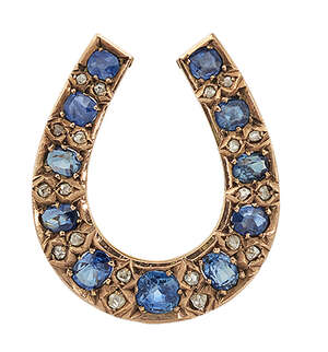 
	
		An Edwardian sapphire and diamond horseshoe brooch, set with graduated cushion-shaped...