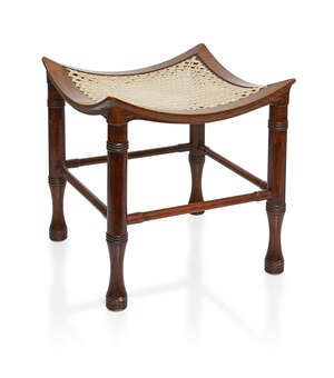 
	
		A stained beech Thebes stool probably retailed by Liberty and Co  
		c.1900, unsigned...